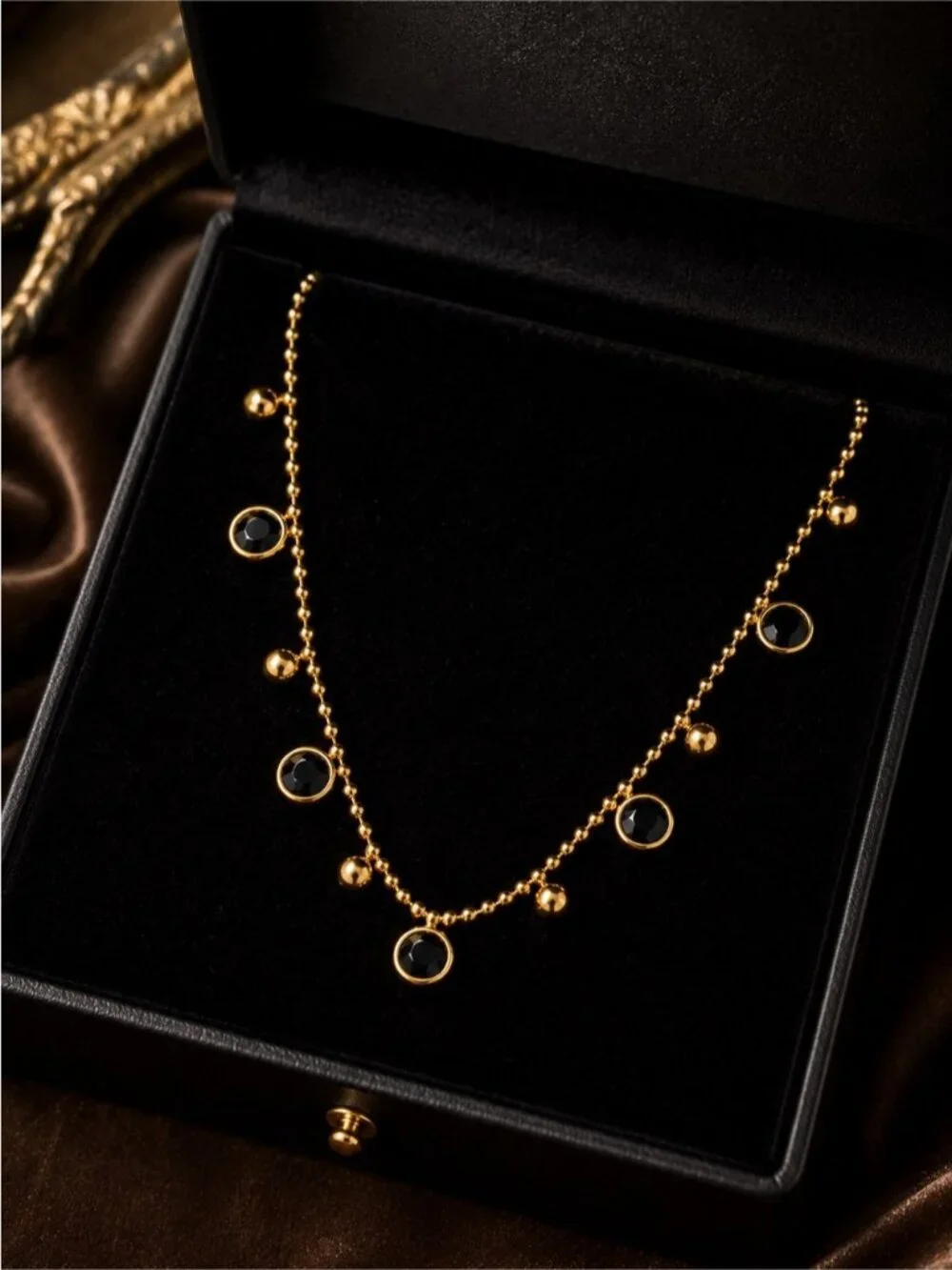 Gold olated Bead Necklace with Black Cabochons